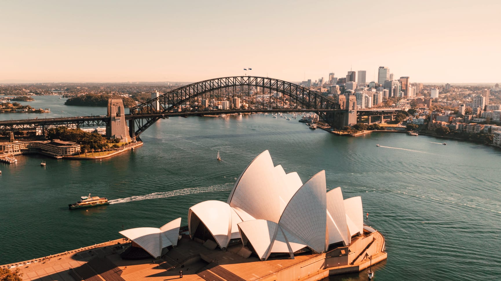 Sydney harbour looking back at North Sydney with the Opera House and Harbour Bridge in view